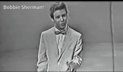 a black and white photo of a man with the name bobbie sherman