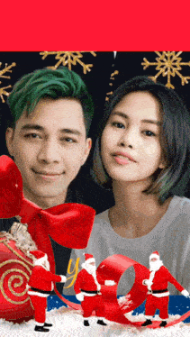 a man and a woman are standing next to each other with santa clauses in the background