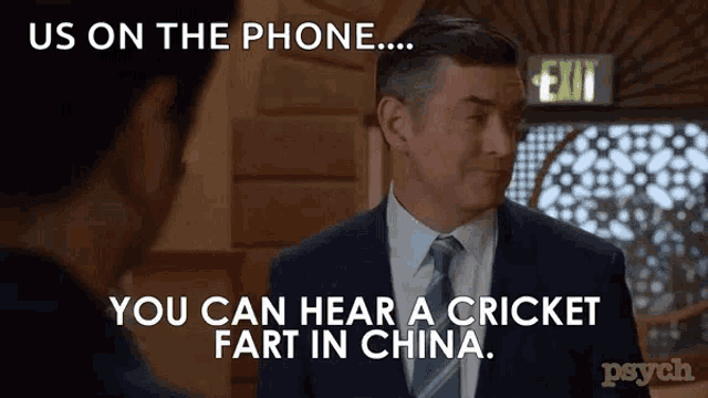 a man in a suit and tie says " us on the phone "
