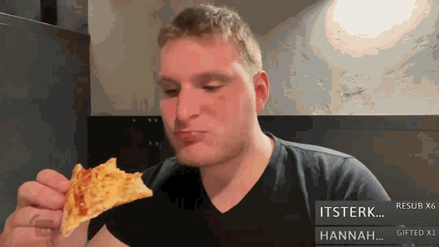 a man in a black shirt is eating a slice of pizza with hannah written below him