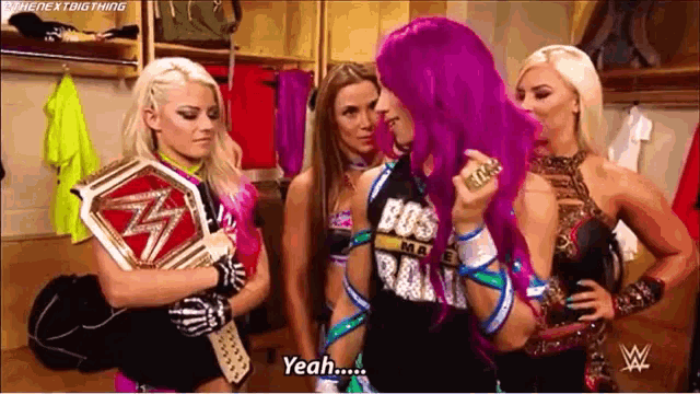 a group of women are standing in a locker room and one of them is wearing a shirt that says boss .