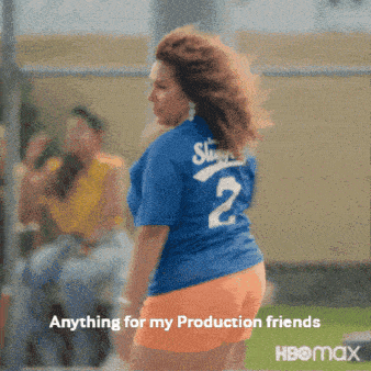 a woman in a blue shirt with the number 2 on the back