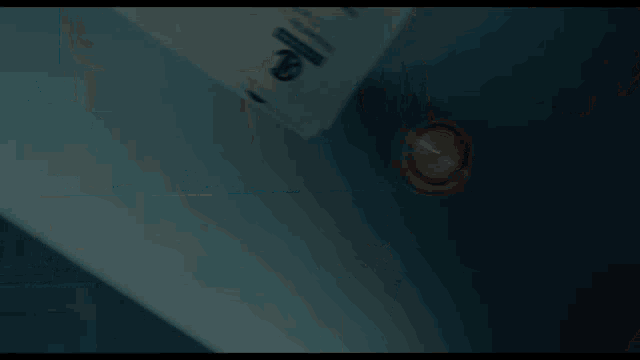 a light is shining through a hole in a ceiling