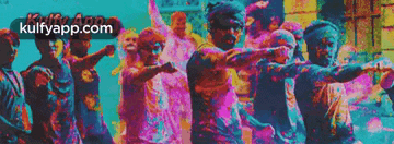 a group of people are dancing in front of a sign that says kulfyapp.com on it