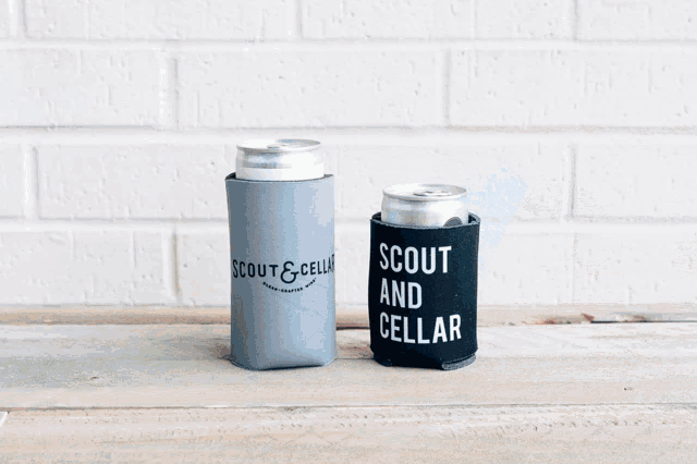 four scout and cell can holders are stacked on top of each other on a wooden surface
