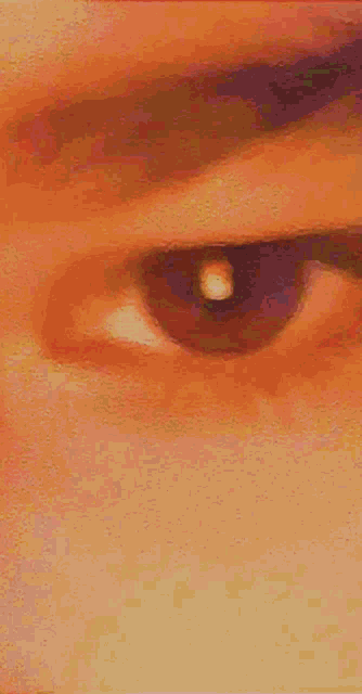 a close up of a person 's eye with a tear in it .
