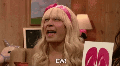 a man in a blonde wig and pink headband is holding a picture of flip flops and says ew .