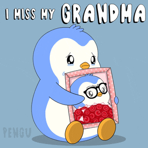 a penguin holding a picture of another penguin with the words i miss my grandma below it