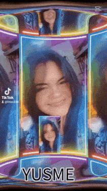 a girl with blue hair is smiling in a colorful frame with the name yusme on it
