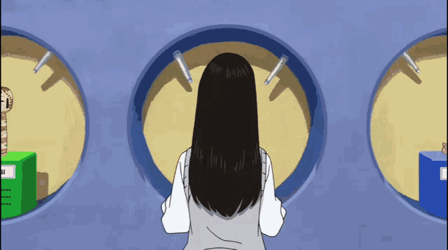 a woman with long black hair stands in front of a clock that says ' a ' on it