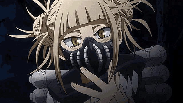 a girl with blonde hair is wearing a mask and holding a gun .