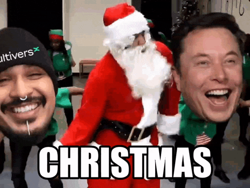 a man in a santa suit is surrounded by other men and the word christmas is on the screen