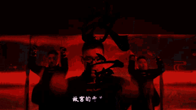 a man wearing glasses is dancing in front of a chinese sign