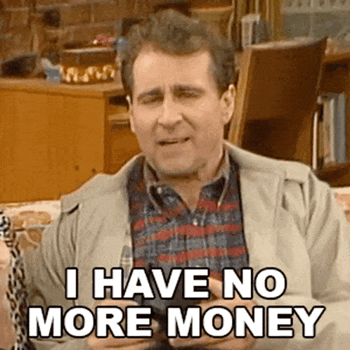 a man in a plaid shirt is holding a wallet and saying i have no more money .