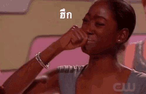 a woman is crying in a foreign language while holding a cell phone .