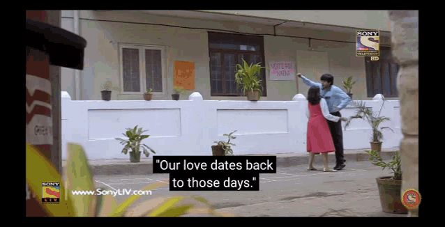 a screen shot of a sony tv show shows a man pointing at a sign that says vote in india