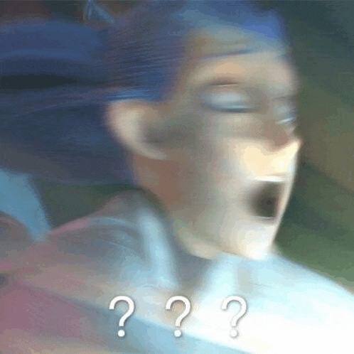 a blurry picture of a cartoon character with a surprised look on his face and a question mark .