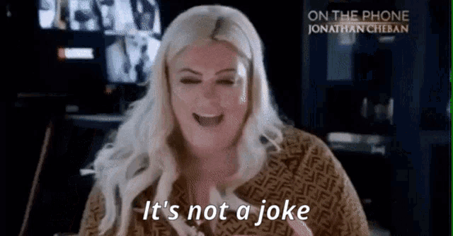 a woman with blonde hair is laughing and saying it 's not a joke .