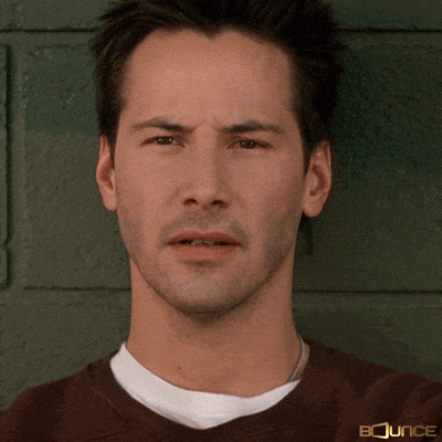 a close up of a man 's face with bounce on his shirt