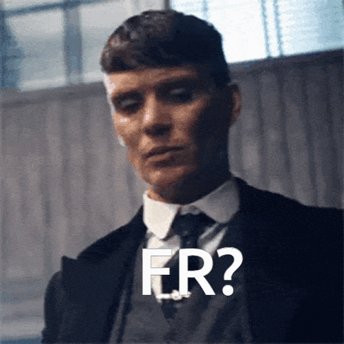 a man in a suit and tie has the word fr written on his face