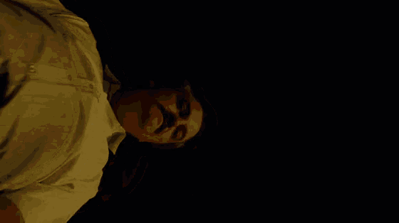 a man with a mustache says look at me in the dark