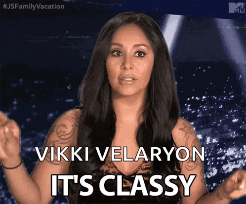 a woman says " vikki velaryon it 's classy " in front of a crowd