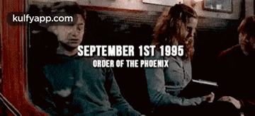 a man and a woman are sitting on a train with the date september 1st 1995 on the bottom .