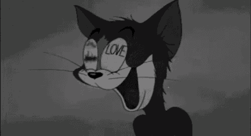 a black and white drawing of a cat with the word love written on its eyes