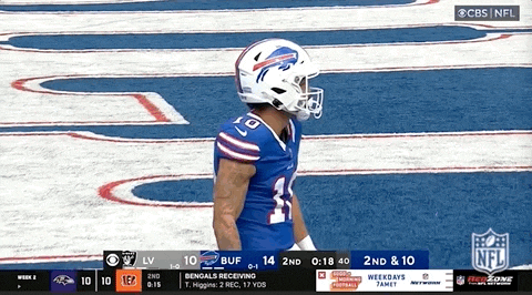 a buffalo bills football player stands on the field during a game