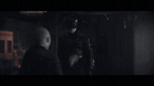 a close up of a man in a batman costume with the words `` don 't hit johnny '' written below him .