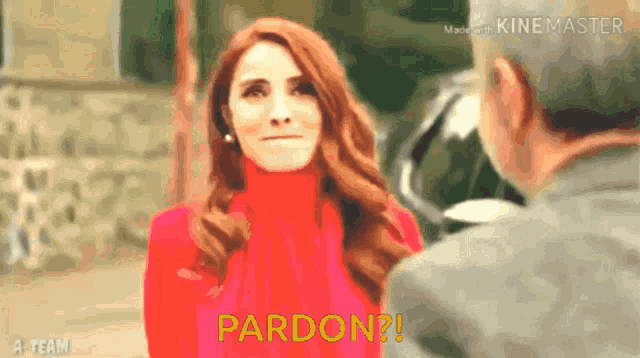 a woman in a red sweater is talking to a man in a video which says pardon ?