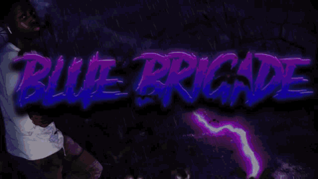 a man in a white shirt is standing in front of a sign that says " blue brigade "