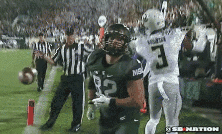 a football player with the number 3 on his jersey is standing on the field