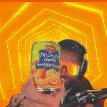 a person is holding a can of no sugar added mandarin orange juice