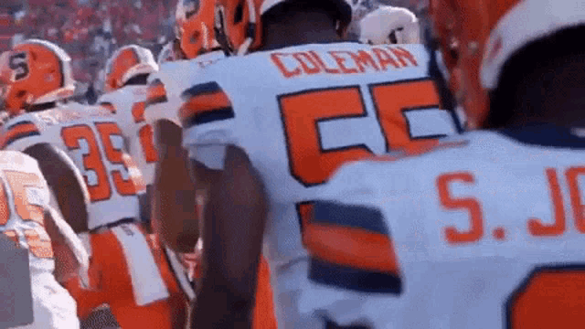 a football player with coleman on the back of his shirt