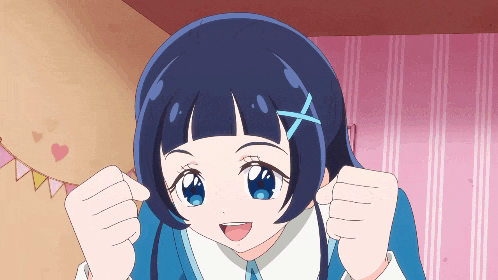 a girl with a blue x in her hair is making a funny face