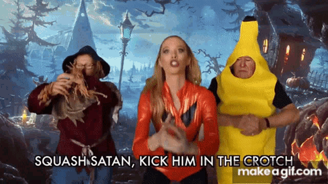 a woman in a scarecrow costume is standing next to a man in a banana suit