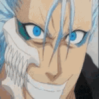a close up of a person 's face with blue eyes and a skull in his mouth .
