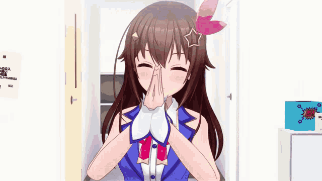 a girl with a star on her head is smiling with her hands folded in front of her face