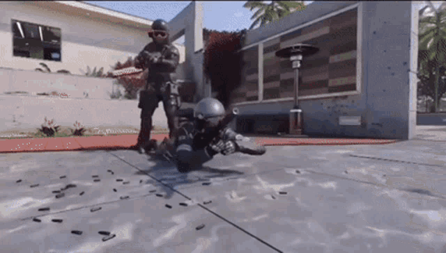 a soldier laying on the ground with bullets coming out of his helmet