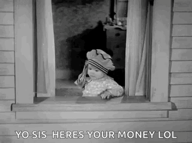a black and white photo of a baby looking out a window .