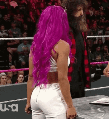 a woman with purple hair in a wrestling ring