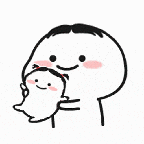 a man is holding a baby in his arms and smiling .