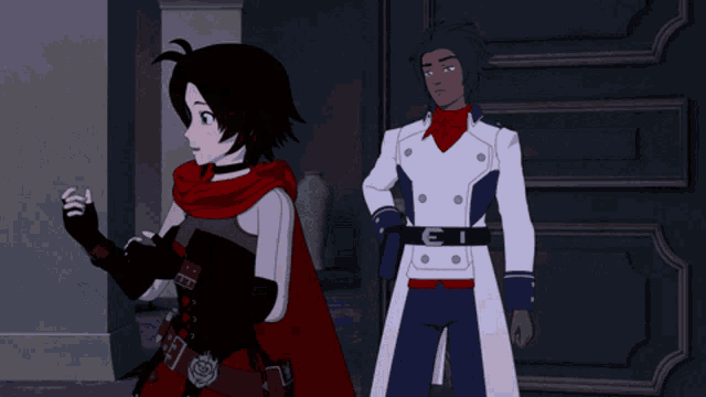 a man and a woman are standing next to each other and the woman is wearing a scarf