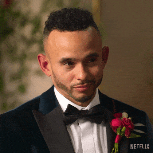 a man wearing a tuxedo and bow tie has a netflix logo on the bottom right