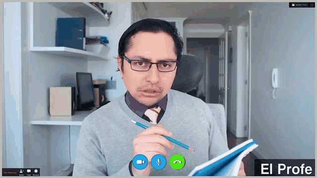 a man wearing glasses and a tie is on a video call with the name el profe at the bottom