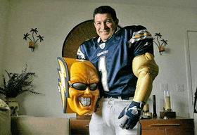 a man wearing a number 1 jersey is holding a yellow mask