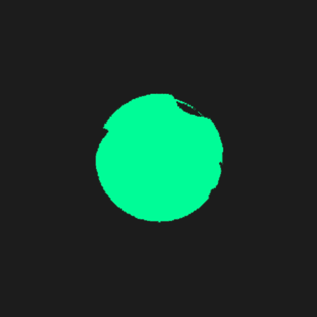 a green drop on a black background that looks like a drop of water