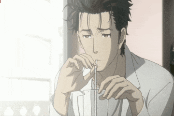 a man with a straw in his mouth is looking down