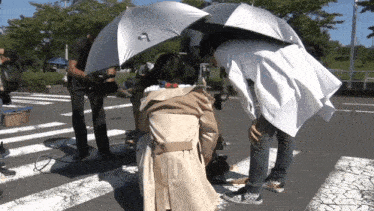 an umbrella with the letter a on it is being held over a person